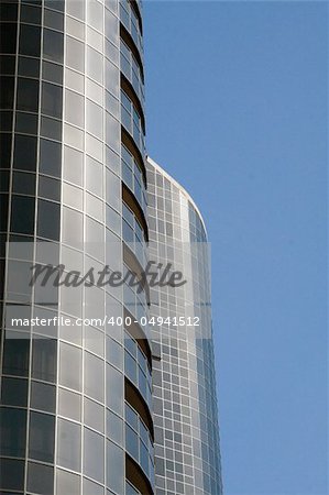 Modern skyscrapers against a bright blue sky