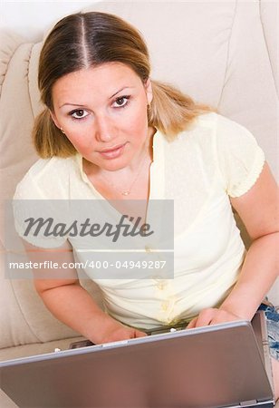 young pretty womay working at laptop computer