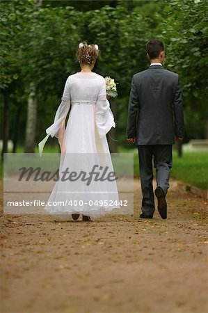 The bride and the groom in park