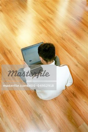 a young business man is holding a notebook in his hands in front of a shiny background