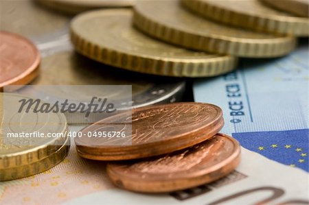 assorted euro coins and notes
