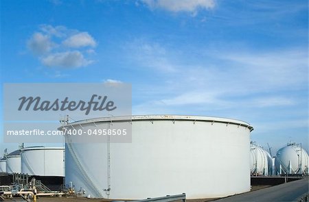 The storage tanks at an oil refinery complex