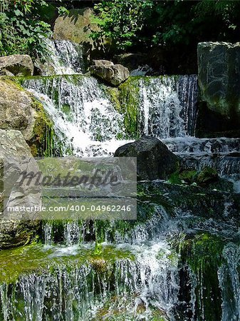 Big mountain water flow cascade on the rocks