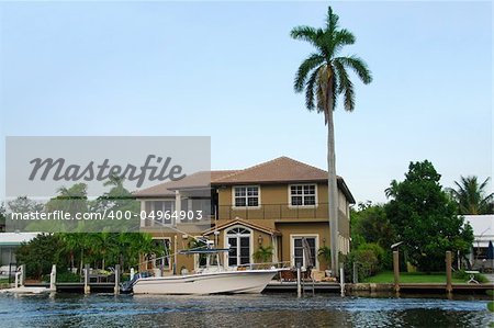 Luxurious home on the water with tropical landscape