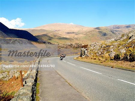 Two bikers on the famous Llanberis Pass, Snowdonia, North Wales.