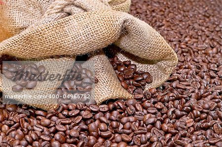 Coffee sack and roasted brown coffee background