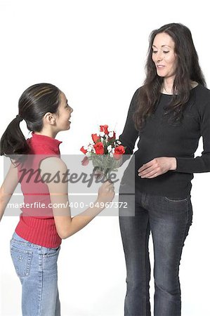 daughter offering flowers to her mother