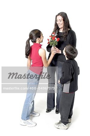 daughter and son offering flowers to her mother