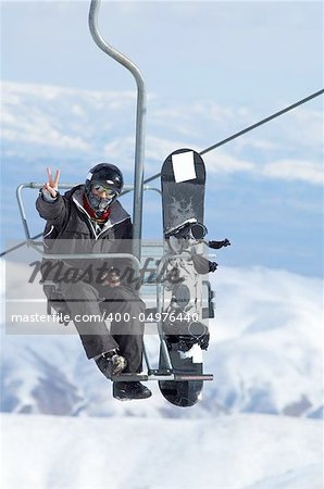 Snowboarder on lift