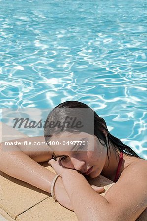 sad teen by the pool
