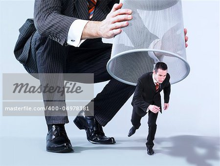 big businessman chasing a little businessman