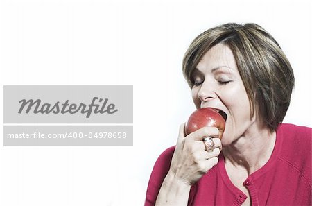 woman eating and apple  over white background