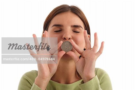 Stock photo of a young woman kissing dollar coin