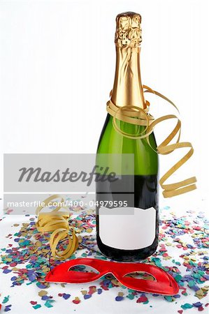 Champagne bottle with red mask, ribbons and confetti. Blank label for add text