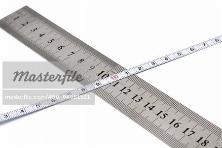 White metal ruler and measuring tape on a white background
