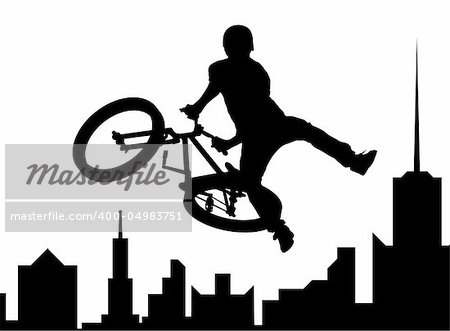 Silhouette of the bicyclist executing a stunt