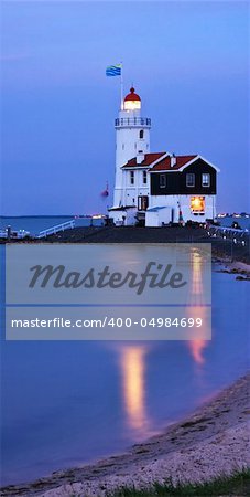 illuminated lighthouse in twilight (Marken, Netherlands)
