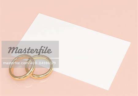 Background with wedding rings and a card