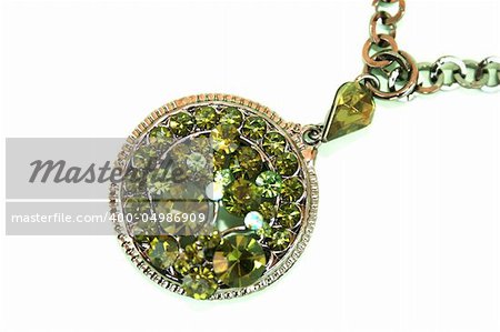 Wonderful necklace with green stones isolated on the white.
