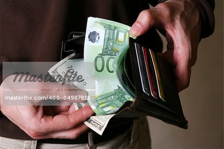 Man's hands with a purse close-up