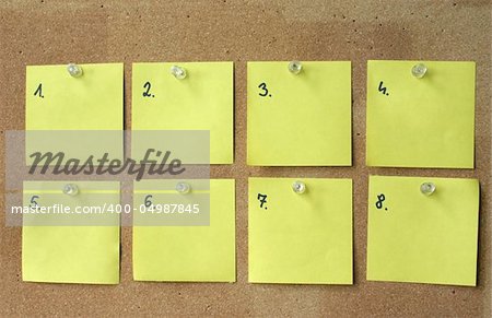 close-up of eight blank paper sheets with numbers