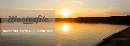 beautiful panoramic view of a sunset over a lake