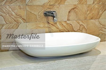 White and wide basin and marble wall