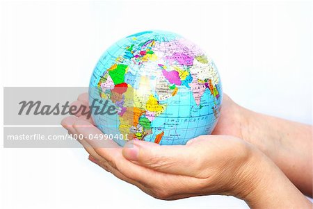 Hands holdings a globe on a whiteness