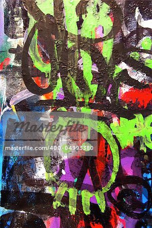 A wall covered with graffiti street art. Youth culture abstract background.