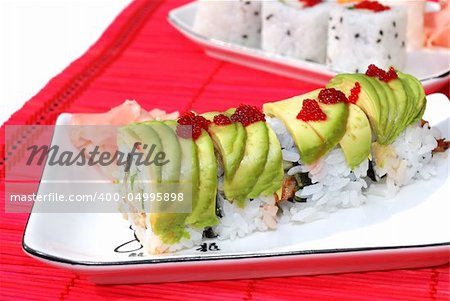 Green dragon sushi and maki combo on a small plate