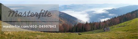 Morning fall mountain plateau panorama and stock-raising shed. Eight shots composite picture. Jaremche-Town outskirts, Ivano-Frankivsk Region, Ukraine.