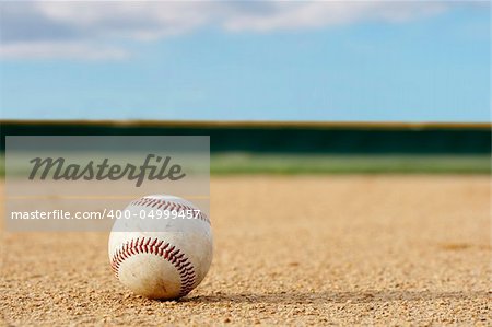 one baseball on infield of sport field