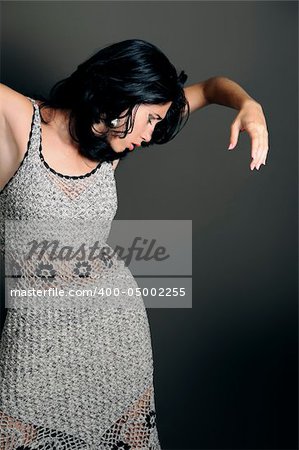 Portrait of young hispanic female dancer posing