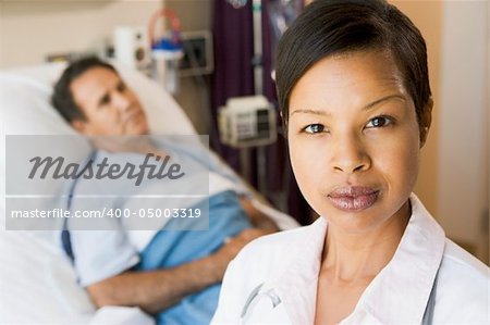 Doctor Looking Serious,Standing In Hospital Room