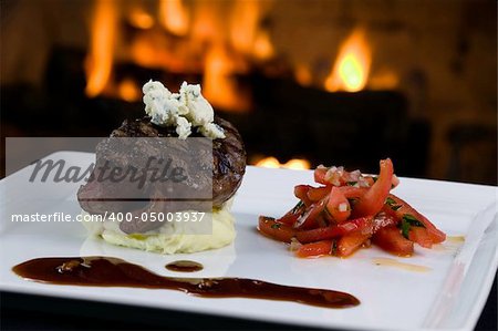 Classic 3 inch center cut filet Mignon fire-grilled to perfection sitting on top of mashed potatoes adorned with bleu cheese.