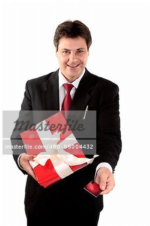 A man buys a  present with a gift card or credit debit card.  Focus to man, shallow dof.