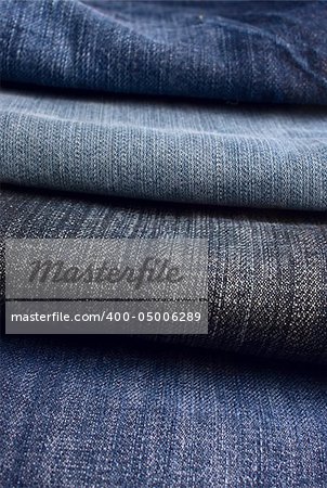 Heap of jeans of different colors