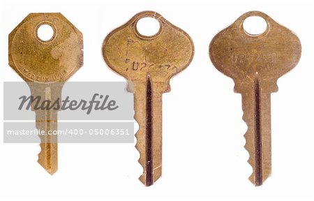 Three old office keys isolated on a white background.