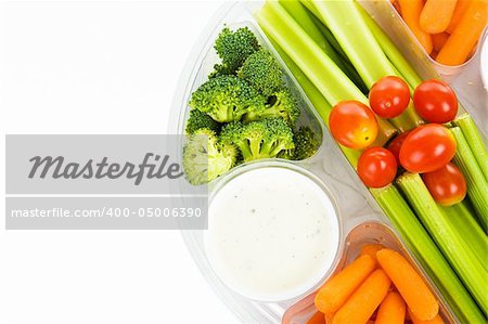 Colorful fresh vegetable party tray isolated on white.