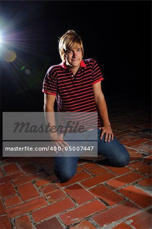 Portrait of casual young male model sitting