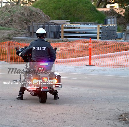 Police officer sitting on Motorcycle