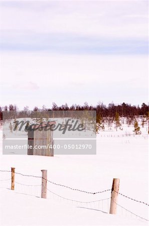 An old building in a snow filled landscape