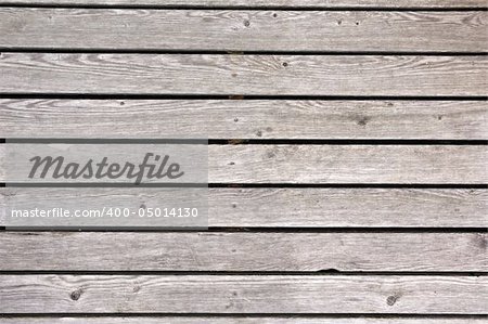 Horizontal wooden plates left outside for years. After that they got this grey color.