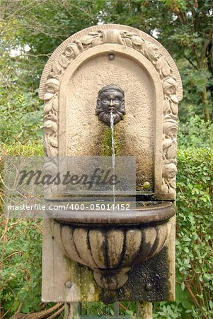 Fountain figure with water running out of its mouth