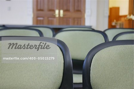 close-up view of row of chairs in meeting area