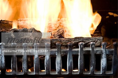 fire burning in a fireplace close up background photo