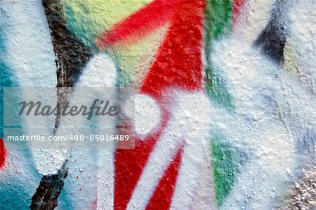 Detail of a wall covered with graffiti.