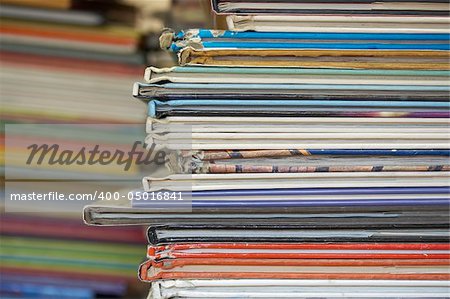 a lot of books stacked on a table