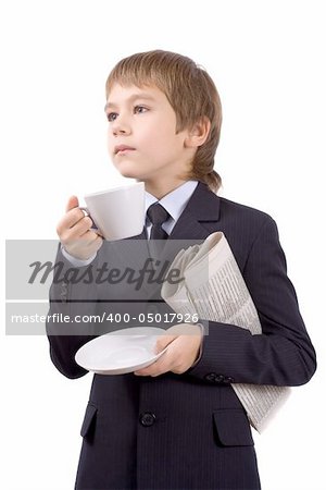 Boy in a business suit with a cup and newspaper, isolated over white