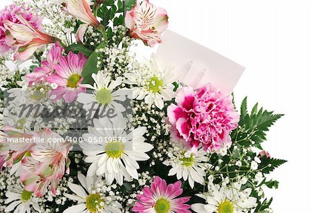 A border of spring flowers with a blank gift card, isolated on white.